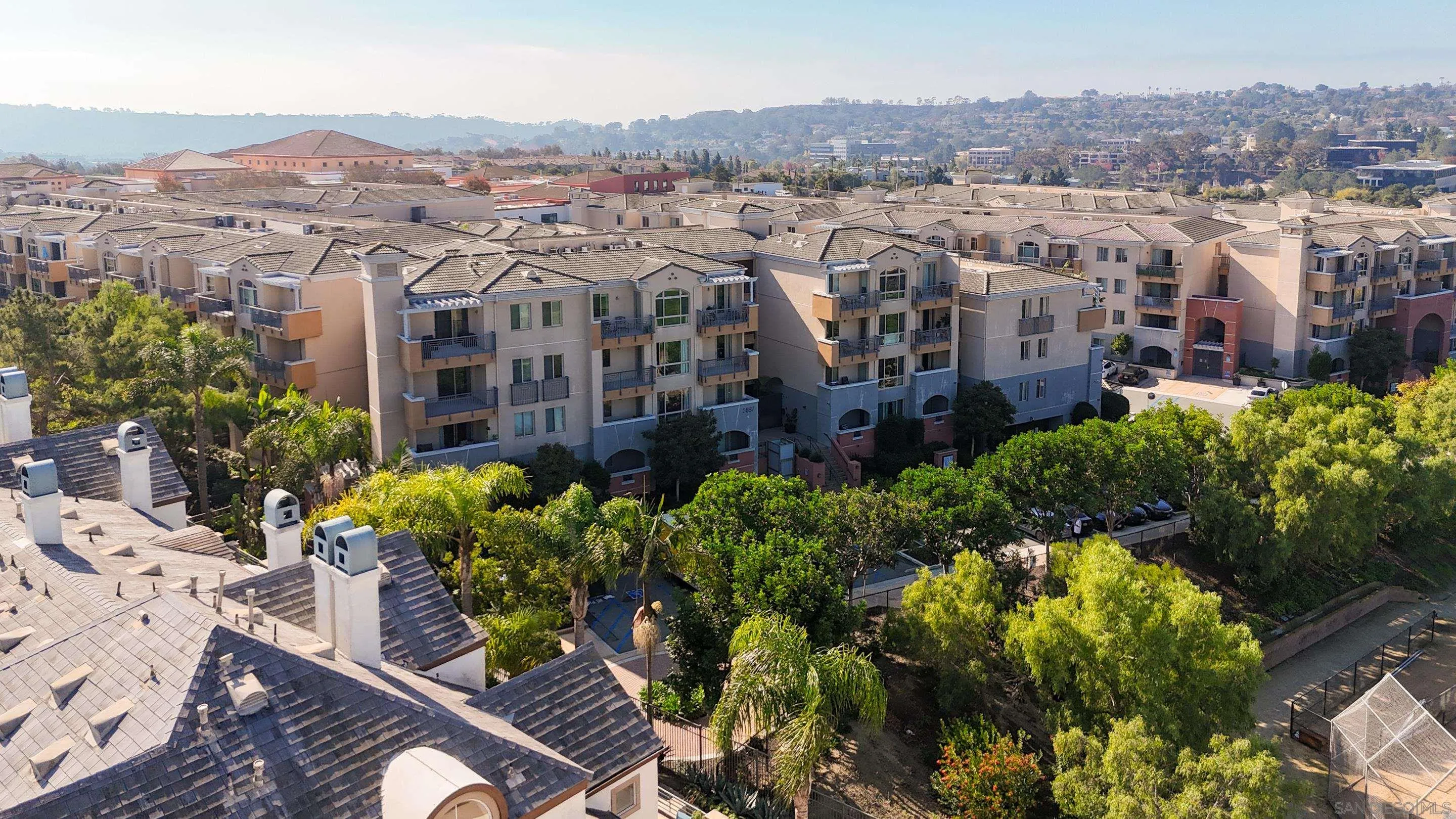 3887 Pell Place, Unit 229 San Diego, CA 92130 - Photo 36 of 49 a view of a city and a building in the background