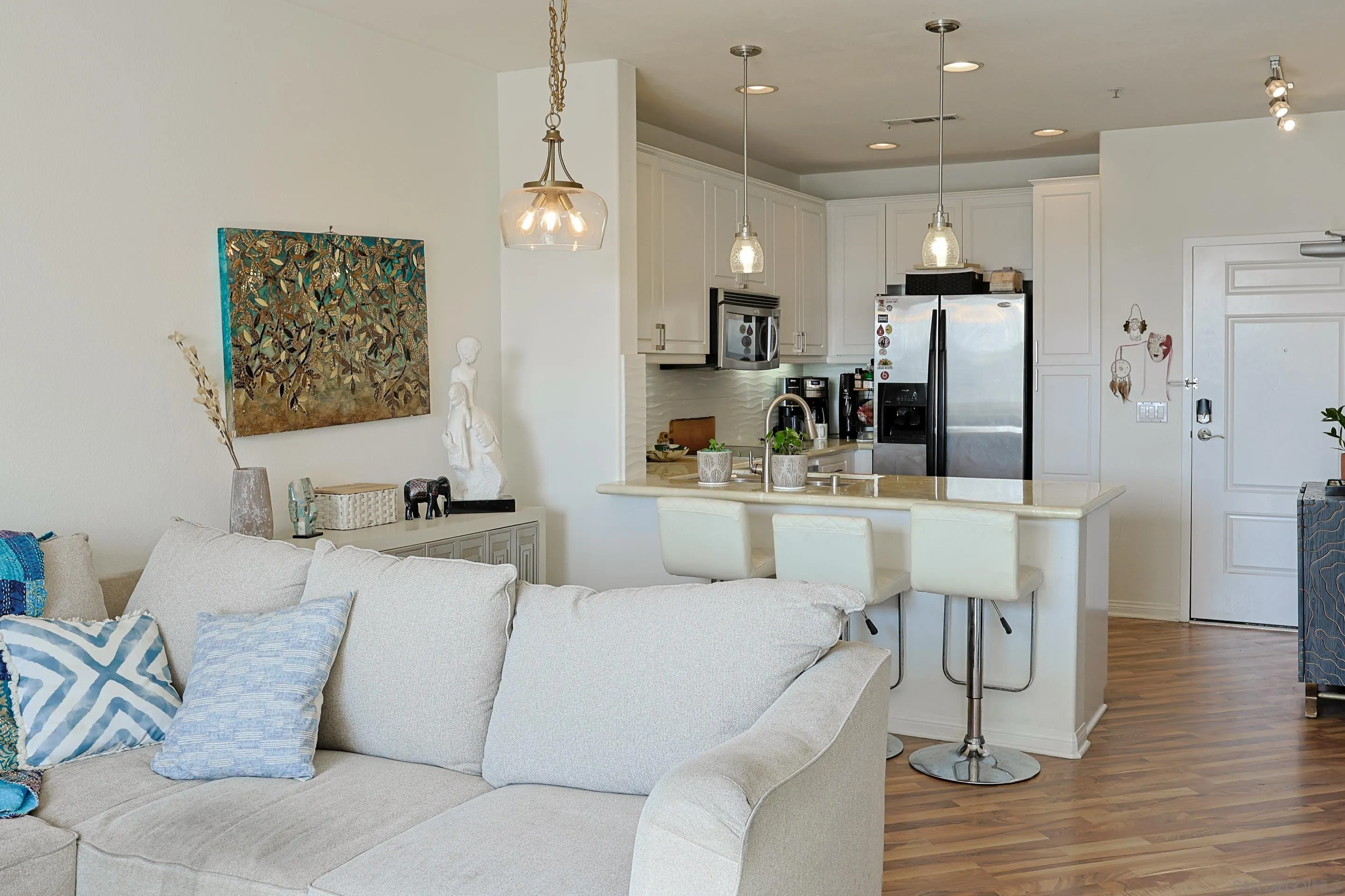 3887 Pell Place, Unit 229 San Diego, CA 92130 - Photo 4 of 49 a living room with furniture and kitchen view