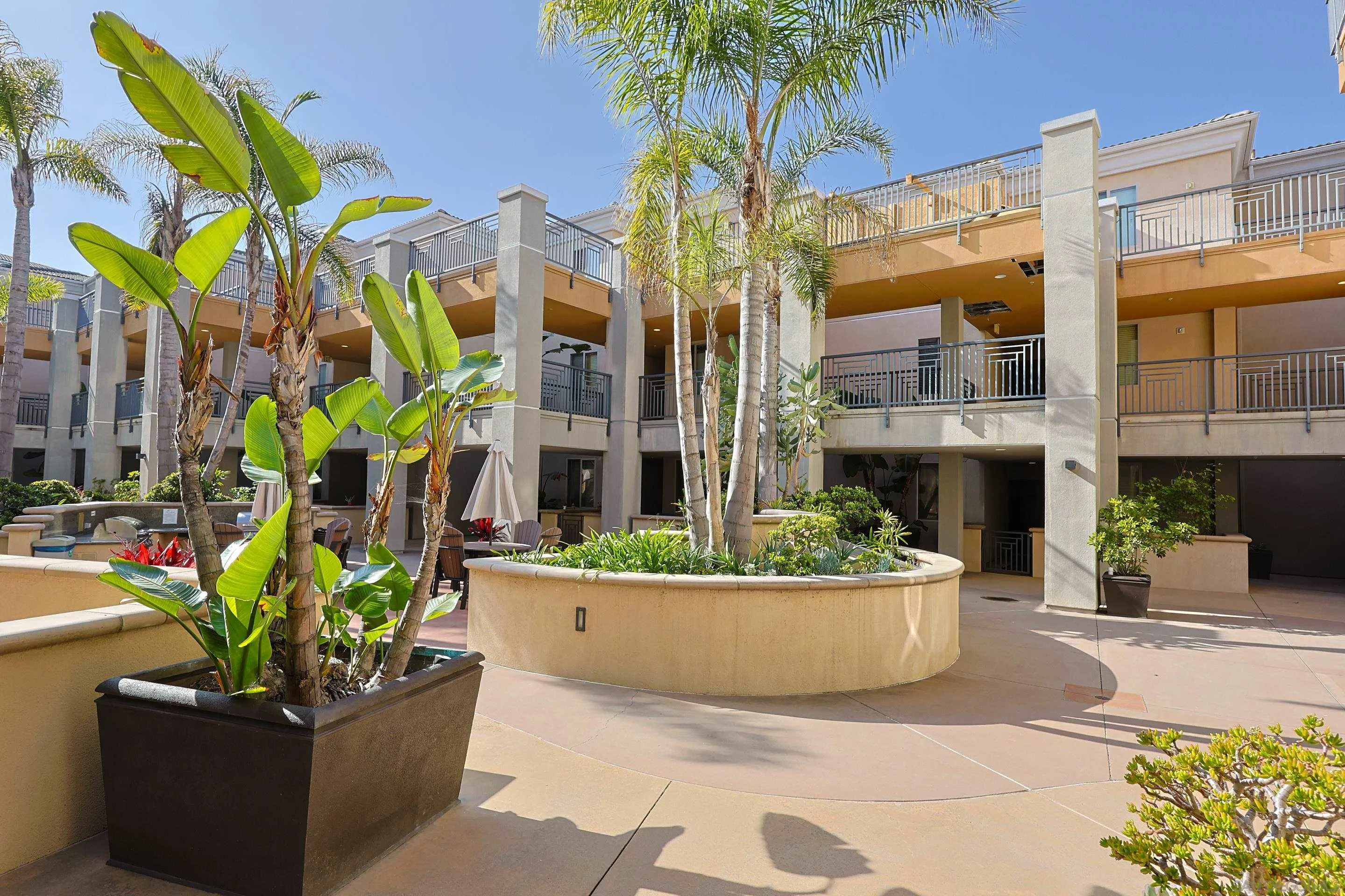 3887 Pell Place, Unit 229 San Diego, CA 92130 - Photo 45 of 49 a front view of a house with a garden