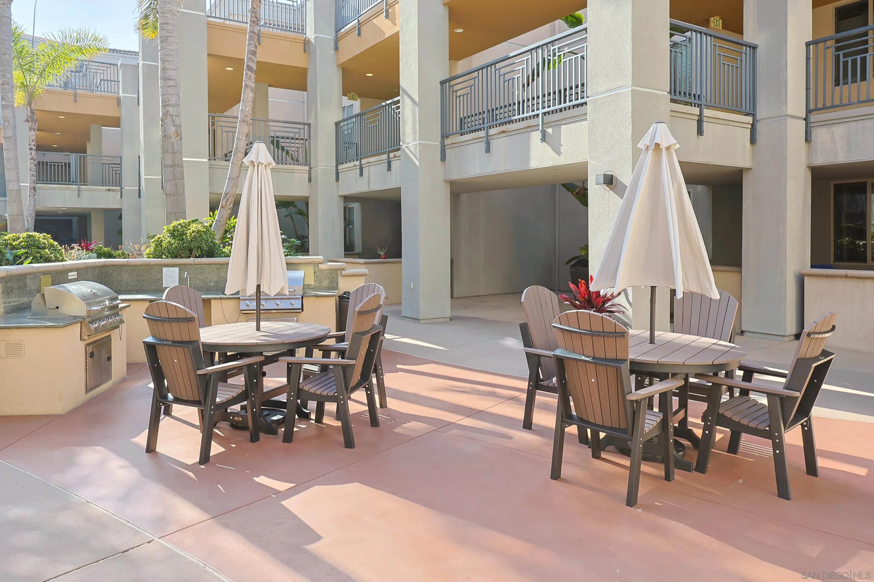 3887 Pell Place, Unit 229 San Diego, CA 92130 - Photo 46 of 49 a view of a dining table and chairs in the patio