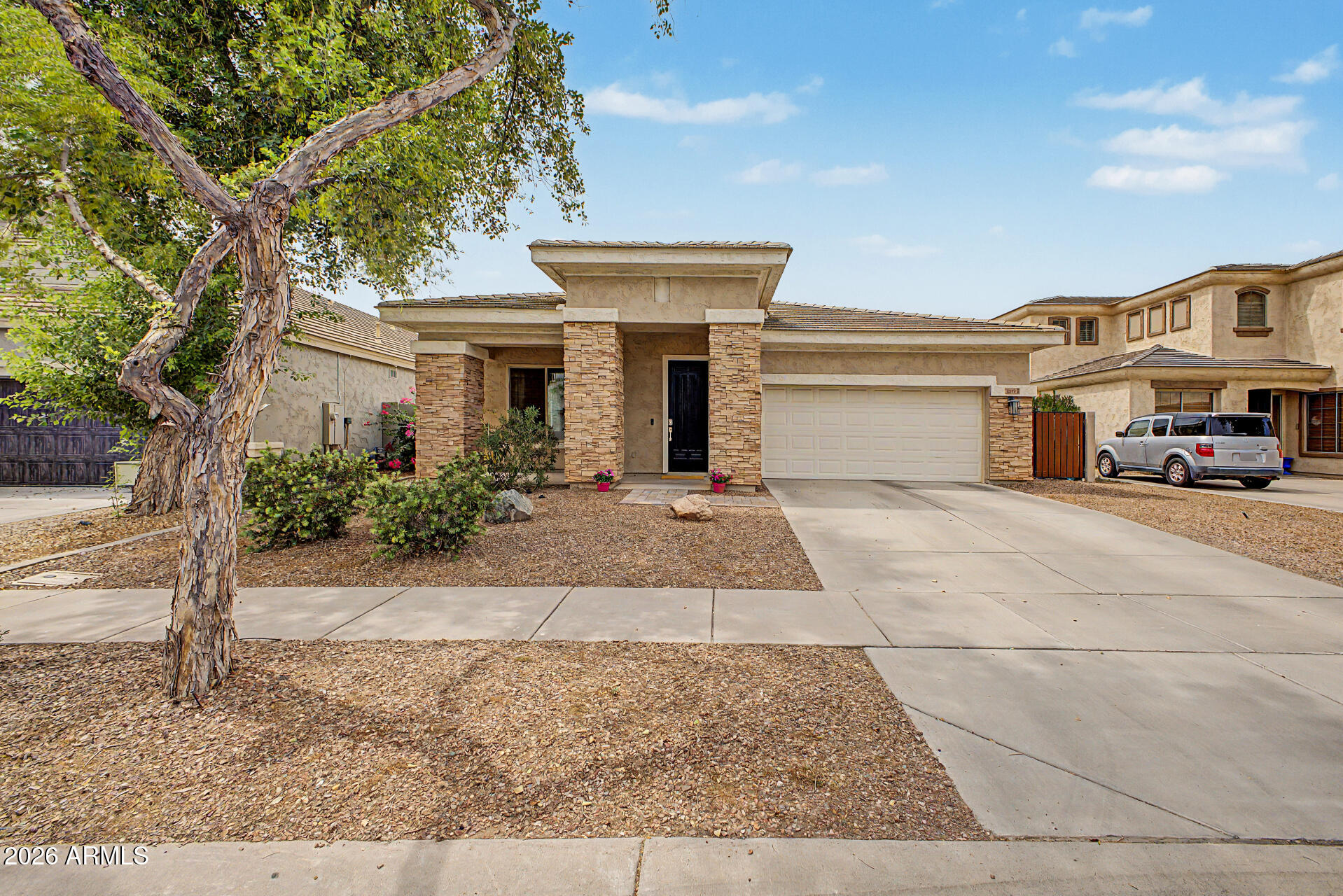 4272 East Buckboard Road Gilbert, AZ 85297 - Photo 2 of 37 front view of a house with a yard