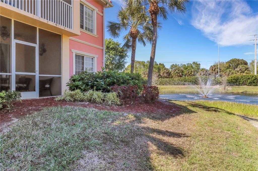 20140 Estero Gardens Circle, Unit 101 Estero, FL 33928 - Photo 24 of 40 a view of a yard with an outdoor space