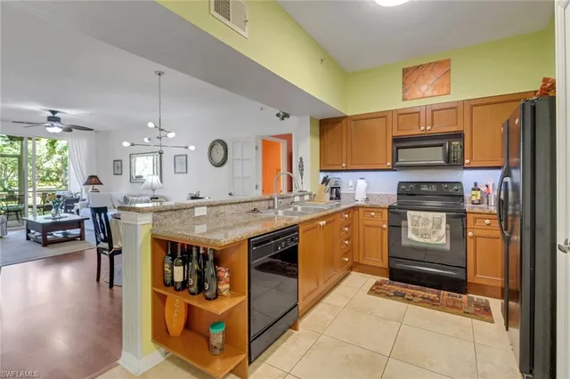 a kitchen with a stove and a refrigerator