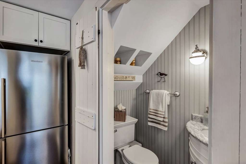 21 Milestone Way, Unit 620 Mashpee, MA 02649 - Photo 12 of 28 a bathroom with a toilet a sink and shower