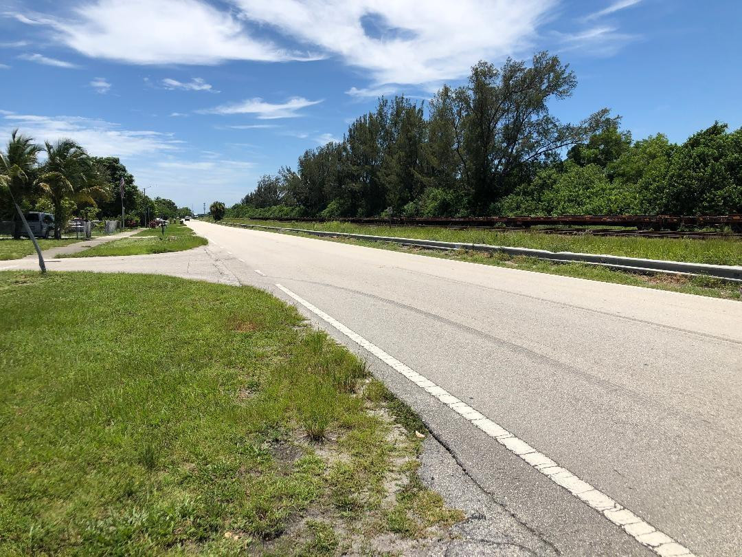 Undisclosed Address Boca Raton, FL 33487 - Photo 11 of 15 a view of a field with trees in the background