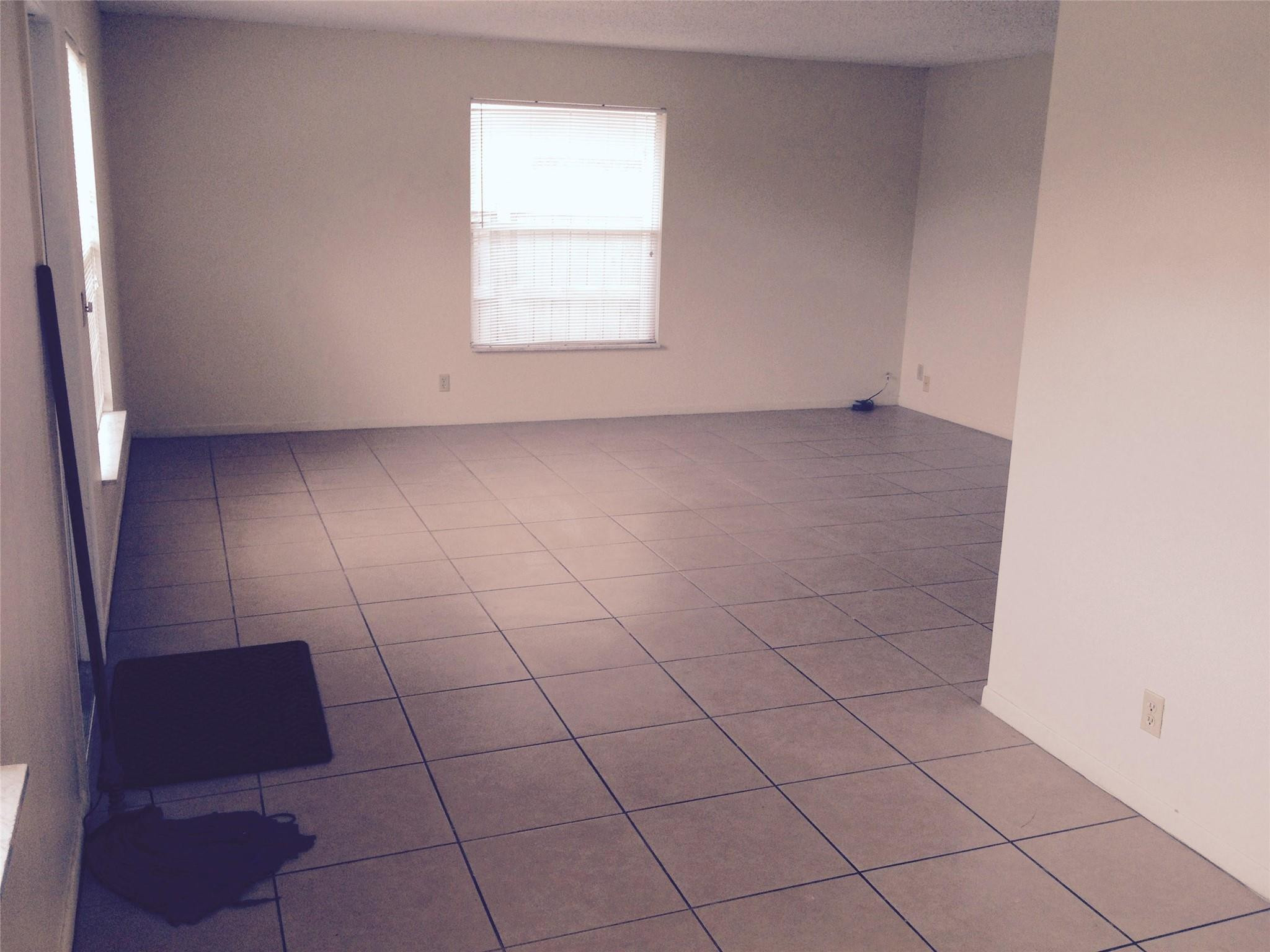 Undisclosed Address Boca Raton, FL 33487 - Photo 3 of 15 an empty room with a white door