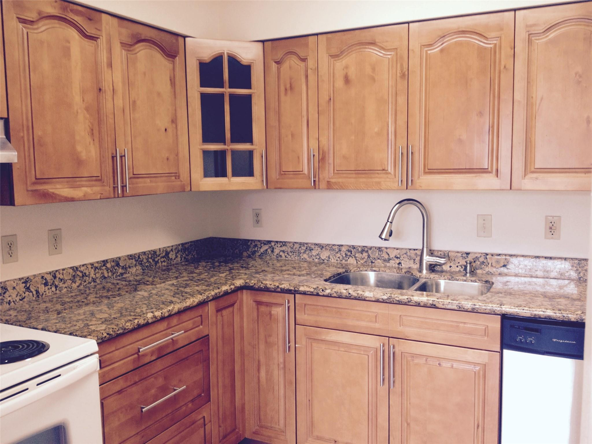 Undisclosed Address Boca Raton, FL 33487 - Photo 8 of 15 a kitchen with stainless steel appliances granite countertop a sink and cabinets with wooden floor