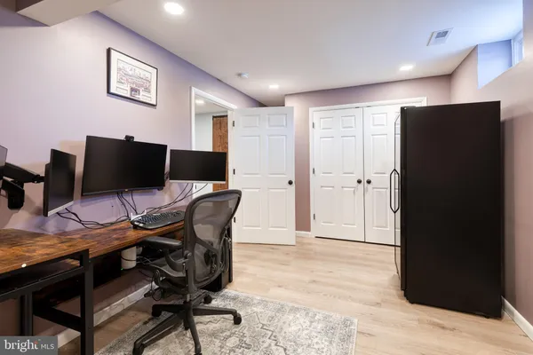 a view of a livingroom with furniture and a flat screen tv