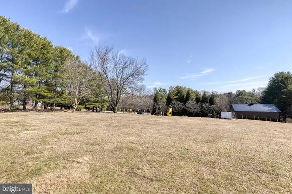 a backyard of a house with trees