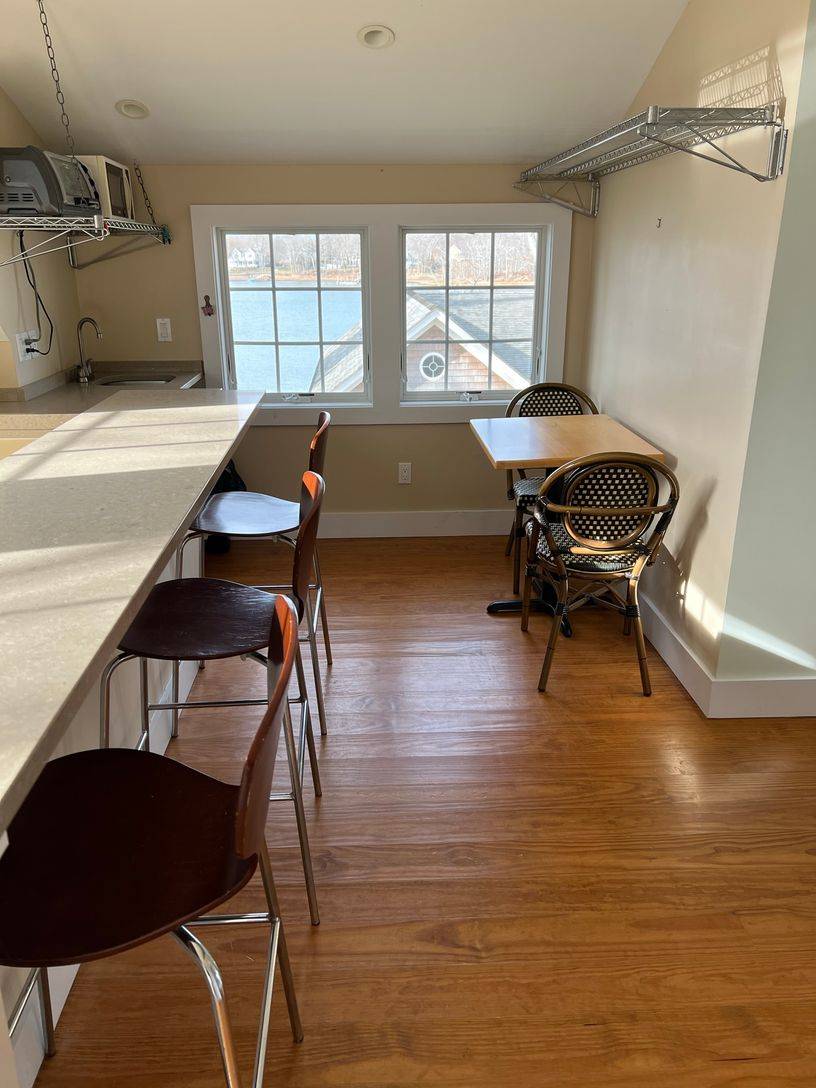 24 South Midway Road Shelter Island, NY 11964 - Photo 14 of 29 a living room with furniture and a window