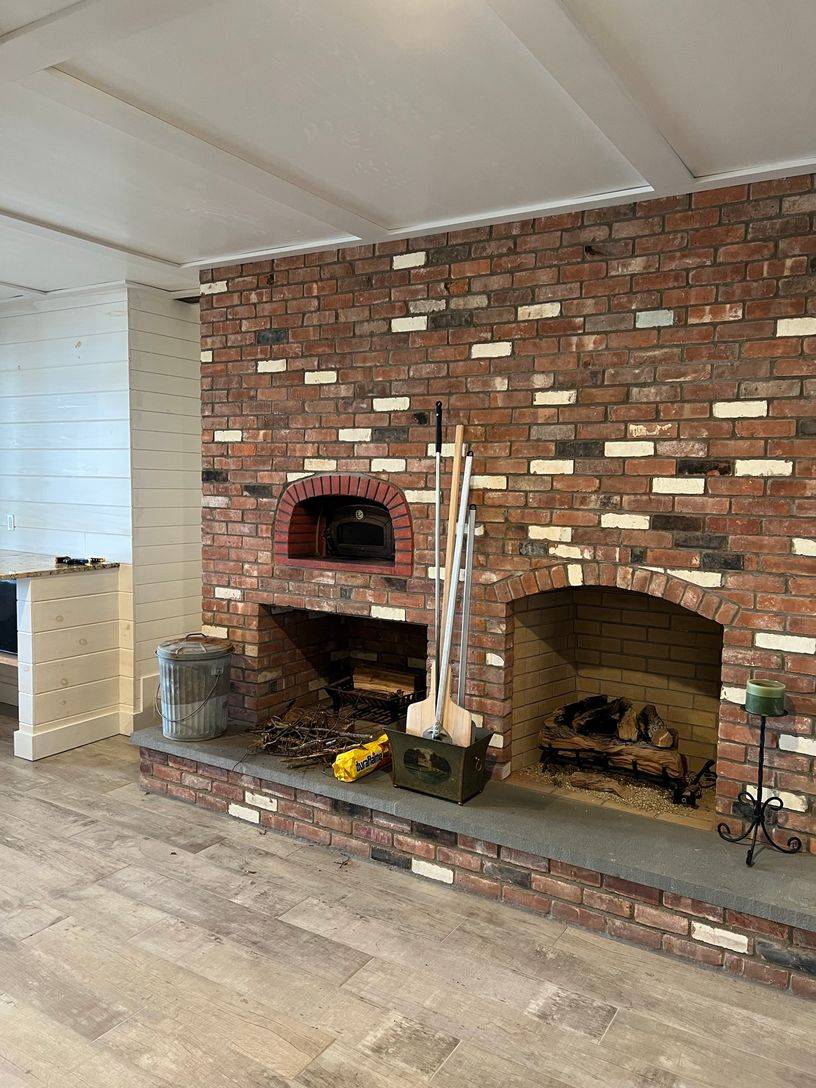 24 South Midway Road Shelter Island, NY 11964 - Photo 22 of 29 a living room with a fireplace