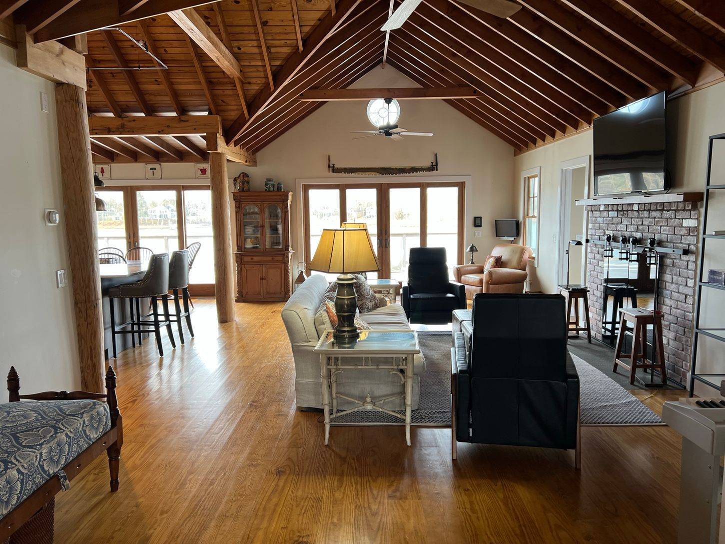 24 South Midway Road Shelter Island, NY 11964 - Photo 4 of 29 a view of a dining room with furniture window and wooden floor