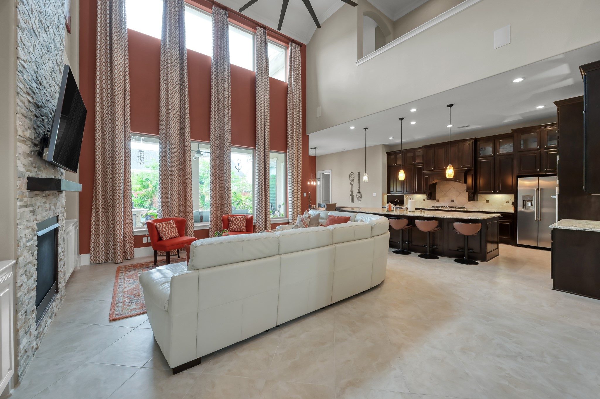 26 Woodborough Way Spring, TX 77389 - Photo 13 of 43 Experience luxury living with elegant upgrades, including sophisticated fans and lighting, in this stunning open-concept home.