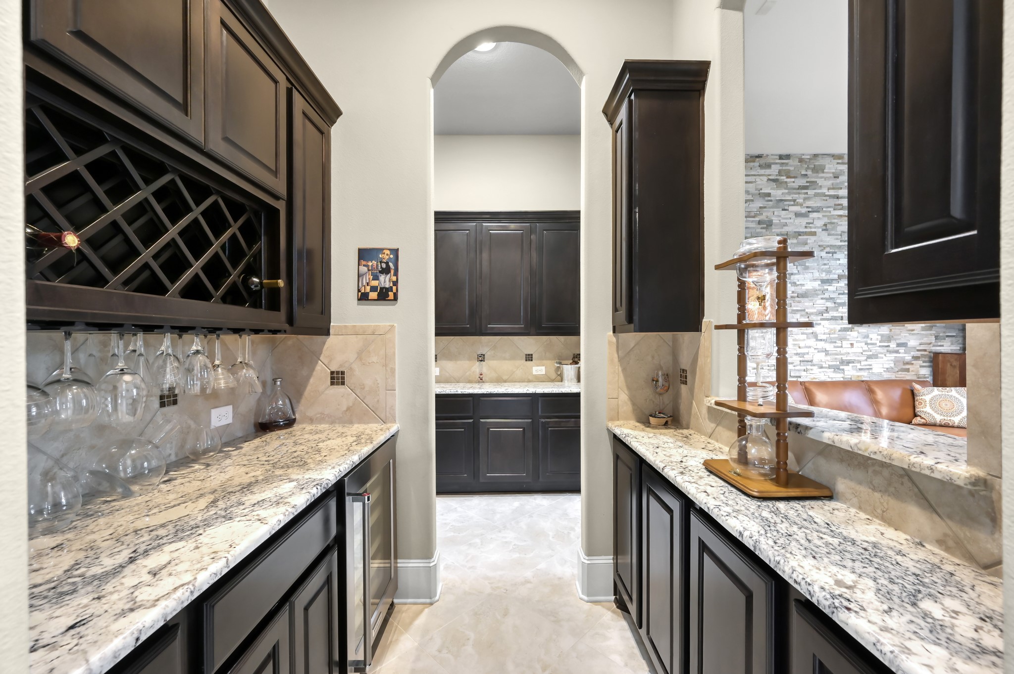 26 Woodborough Way Spring, TX 77389 - Photo 16 of 43 Elevate your entertaining with this stylish and inviting separate wine bar, perfect for hosting unforgettable gatherings.