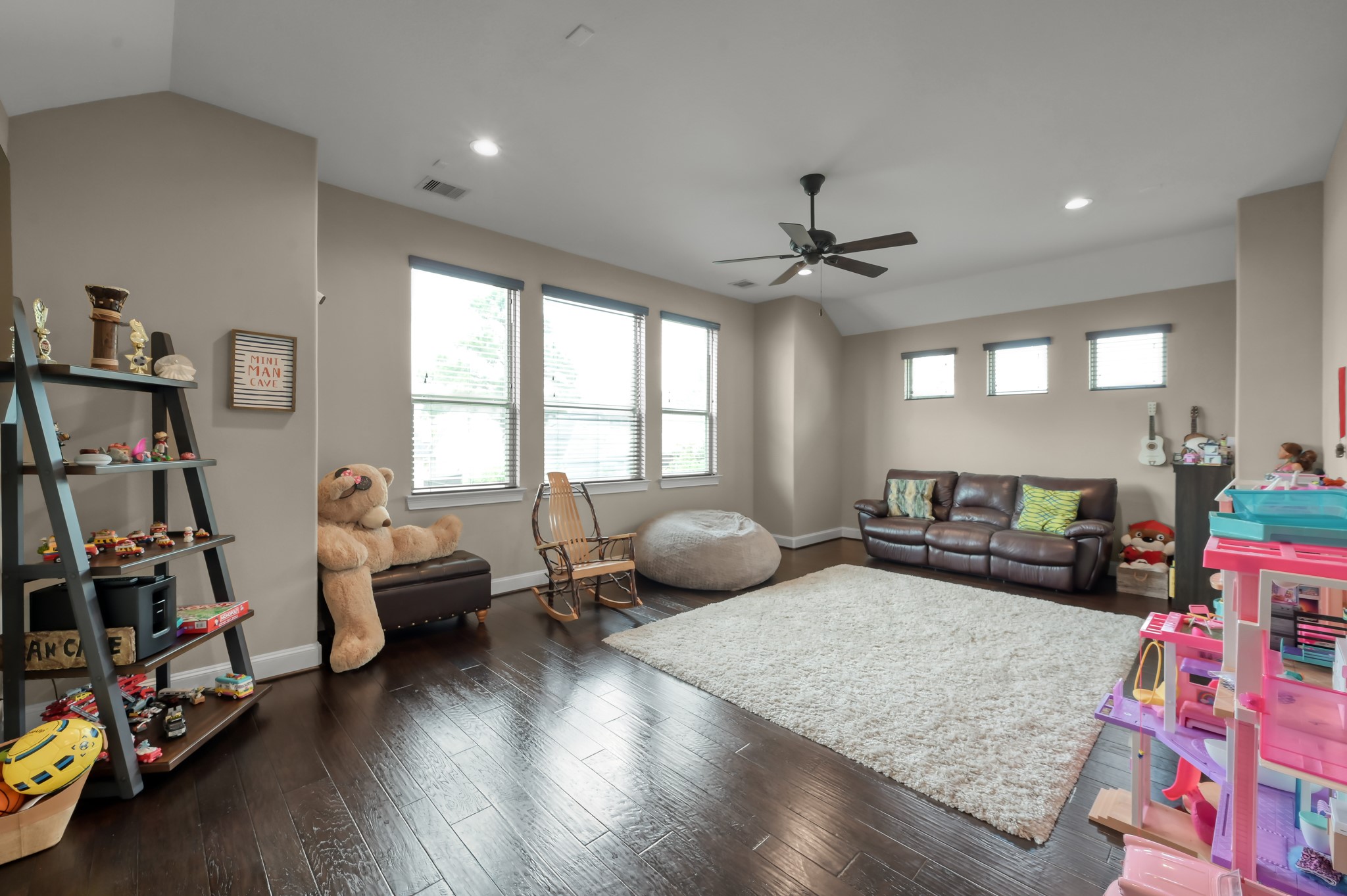 26 Woodborough Way Spring, TX 77389 - Photo 36 of 43 This spacious gameroom features hardwood floors and large windows for natural light.