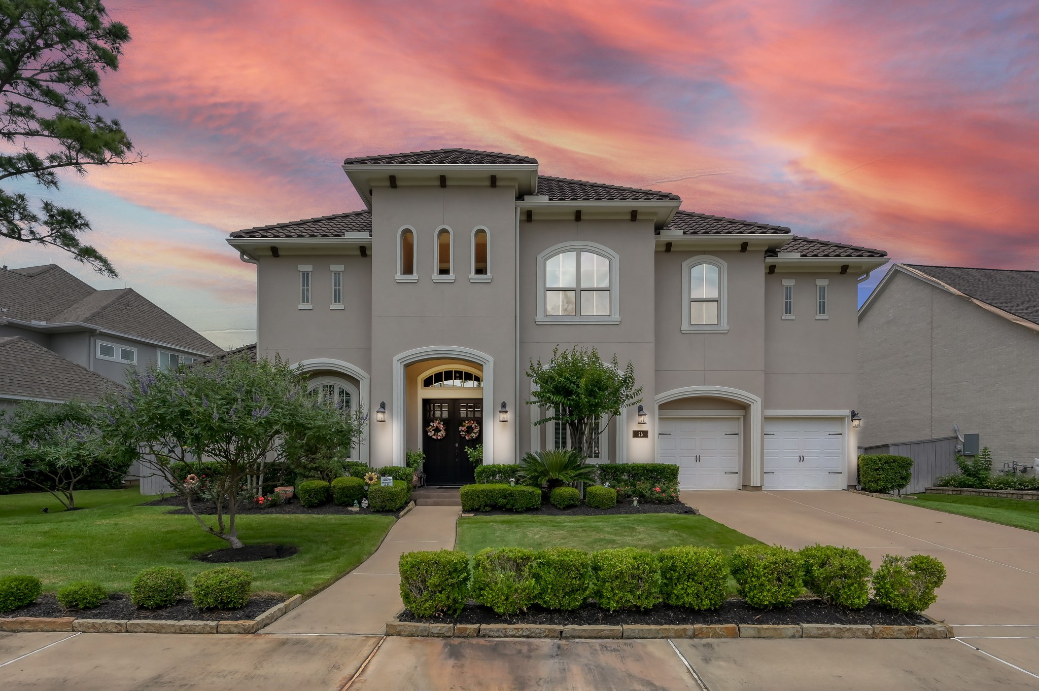26 Woodborough Way Spring, TX 77389 - Photo 37 of 43 This elegant two-story home features a stucco exterior with a tile roof, framed by lush landscaping. This 5 bedroom, 5.5 bath home with a pool/spa in Liberty Branch is stunning.