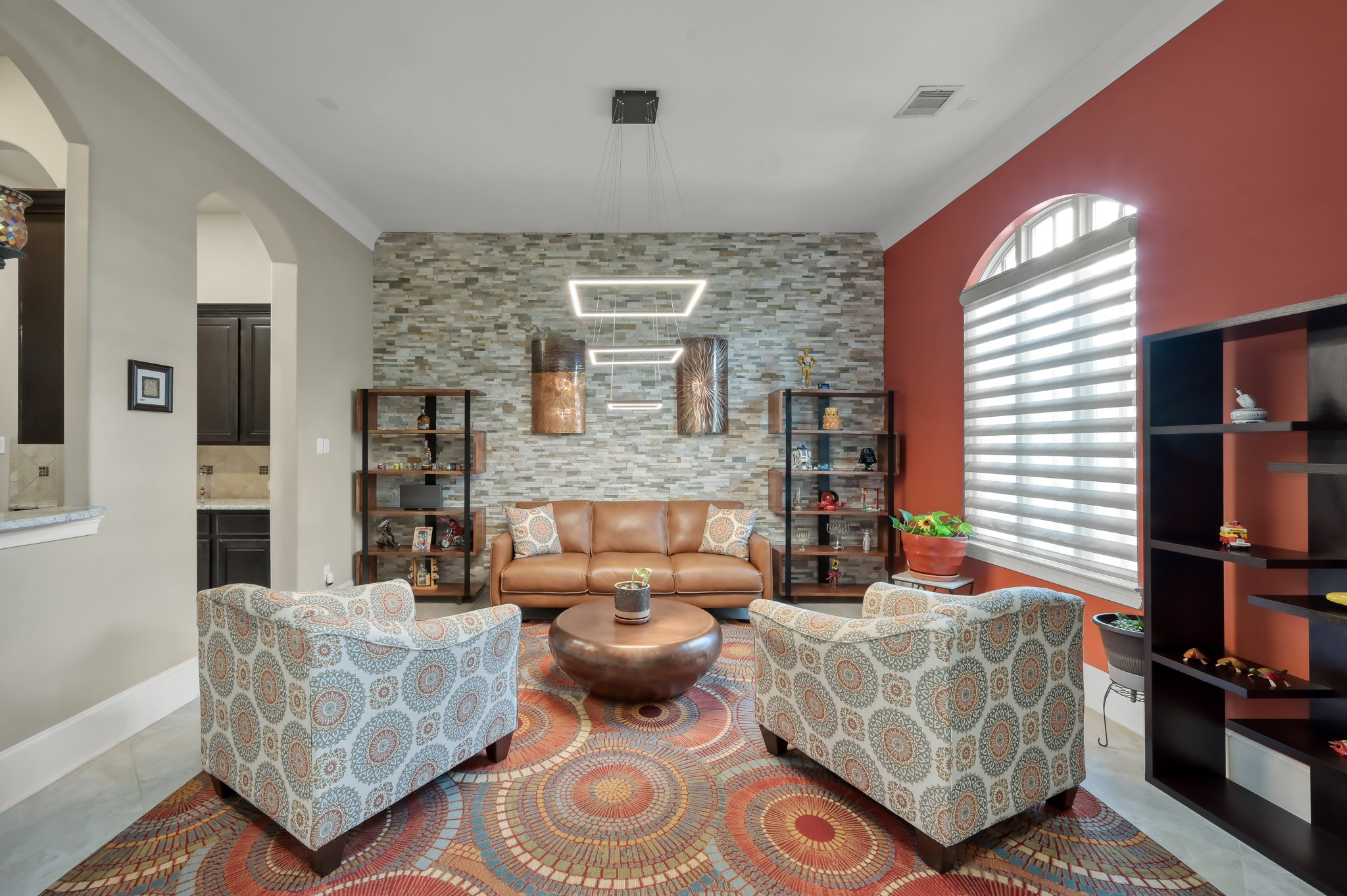 26 Woodborough Way Spring, TX 77389 - Photo 10 of 43 This stylish space transforms a formal dining area into a cozy and inviting seating area, perfect for relaxation and conversation.
