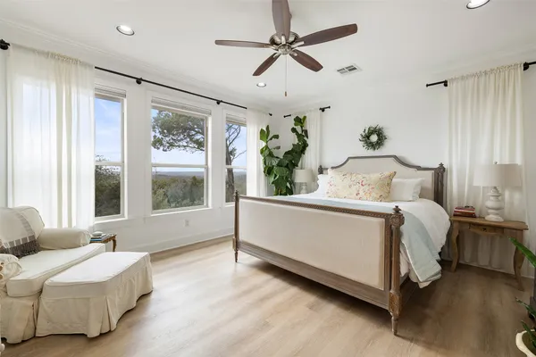 a bed room with a bed window and a couch