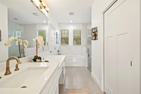 a white bath tub sitting next to a window