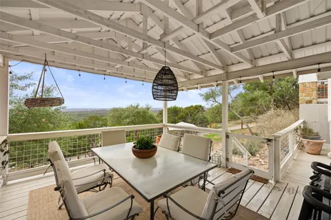 a table and chairs under an umbrella