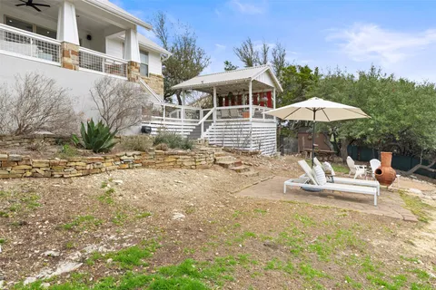 a view of a chair and table on the patio