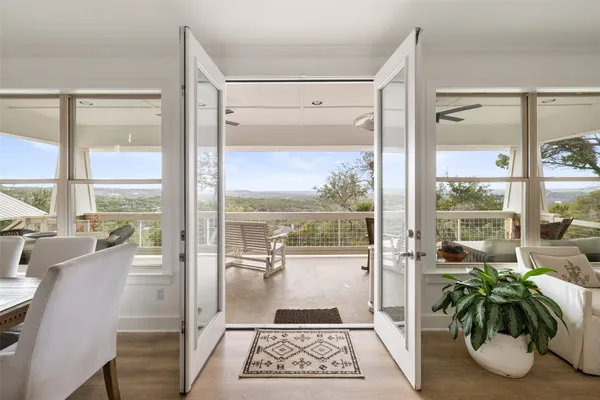 a view of a balcony with wooden floor