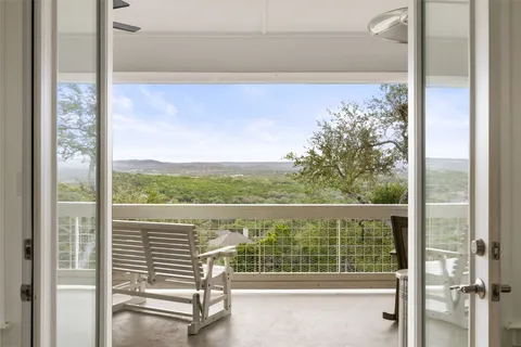 a view of a balcony with lake view and a ocean view