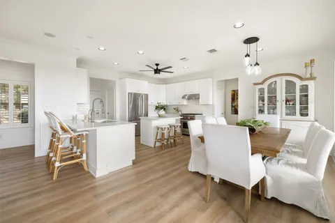 a living room with kitchen island furniture and a wooden floor