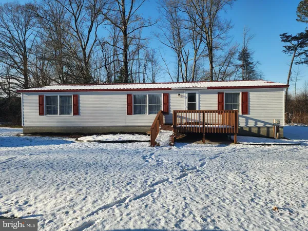 a house with trees in the background