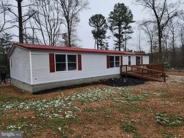 a house with trees in the background