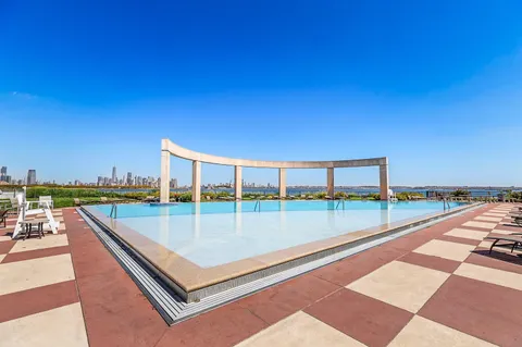a view of a swimming pool with a terrace