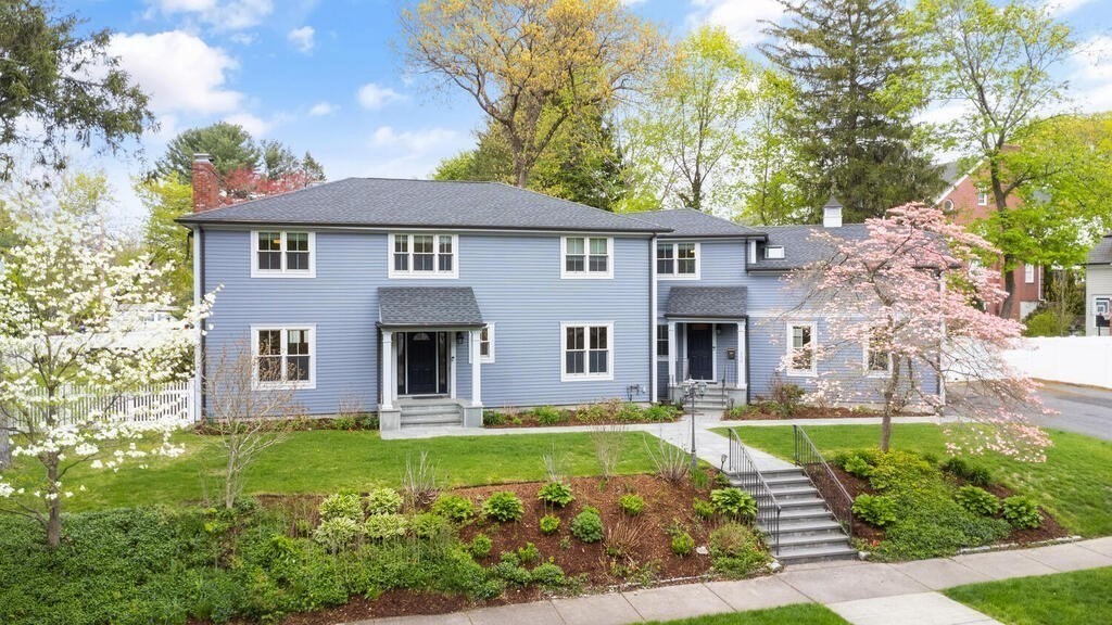 a front view of a house with garden