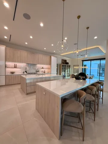 a view of living room with a floor to ceiling window and wooden floor