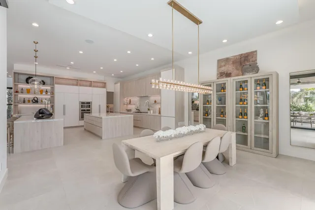 a view of a hallway with wooden floor and couch