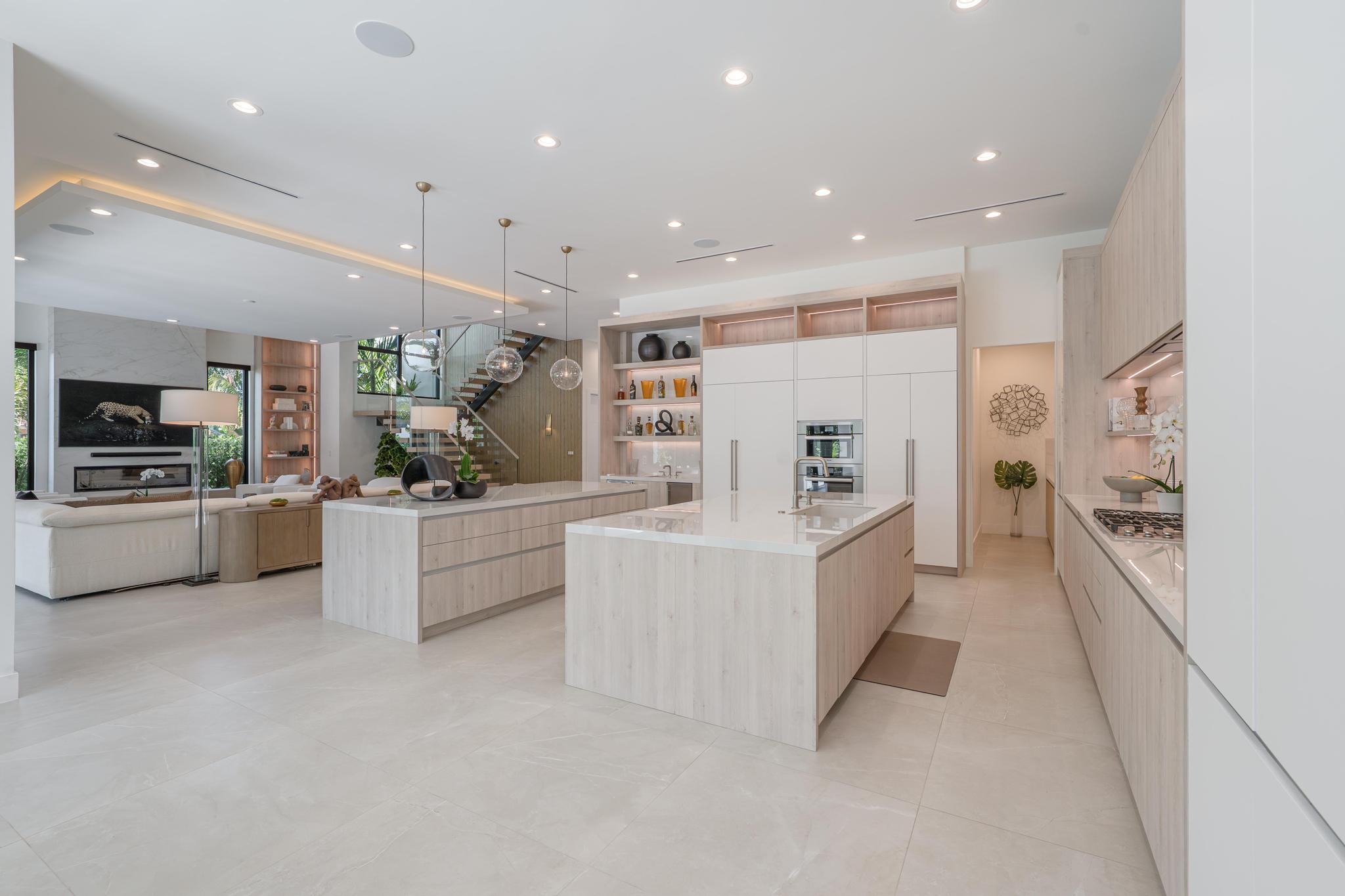 400 Northeast 4th Street Boca Raton, FL 33432 - Photo 21 of 73 a large white kitchen with a large window and stainless steel appliances