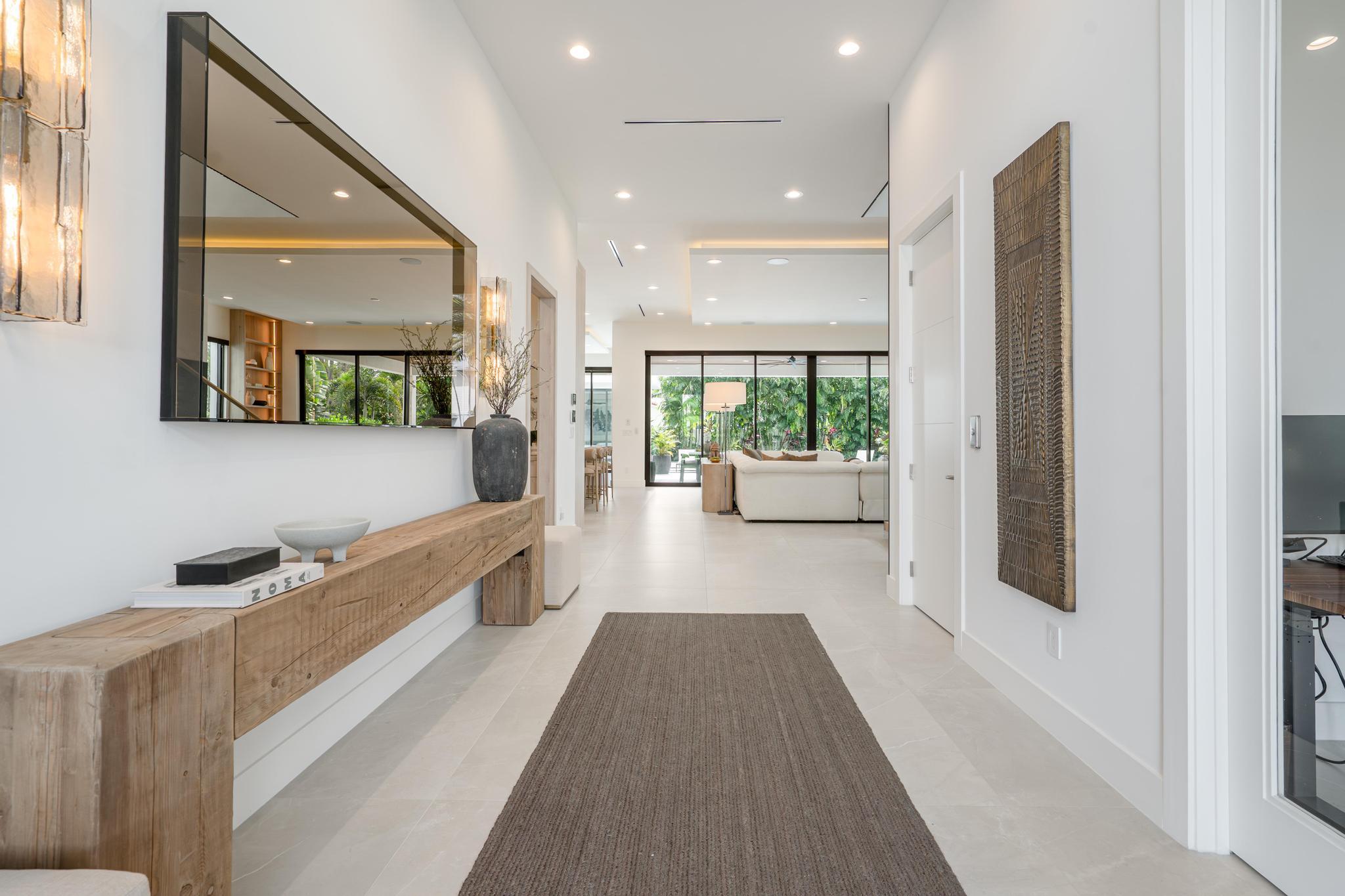 400 Northeast 4th Street Boca Raton, FL 33432 - Photo 23 of 73 a view of a hallway with wooden floor and couch