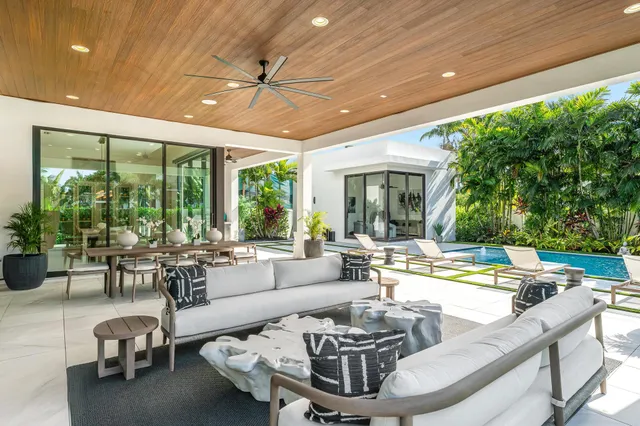 a bathroom with a glass shower door a sink and a bathtub