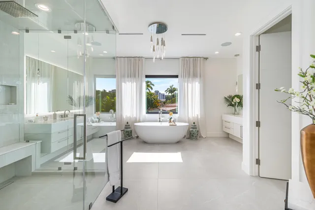 a living room with furniture a flat screen tv and a large window