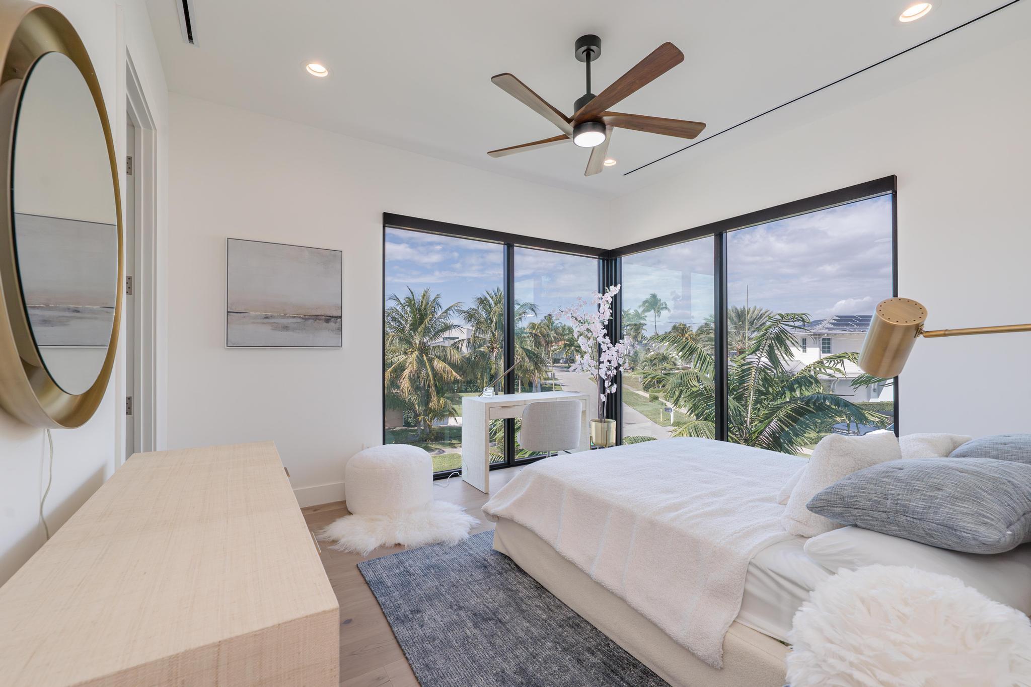 400 Northeast 4th Street Boca Raton, FL 33432 - Photo 46 of 73 a bedroom with a large bed and a large window