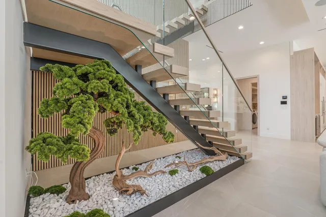 a vase of flowers sitting on a floor