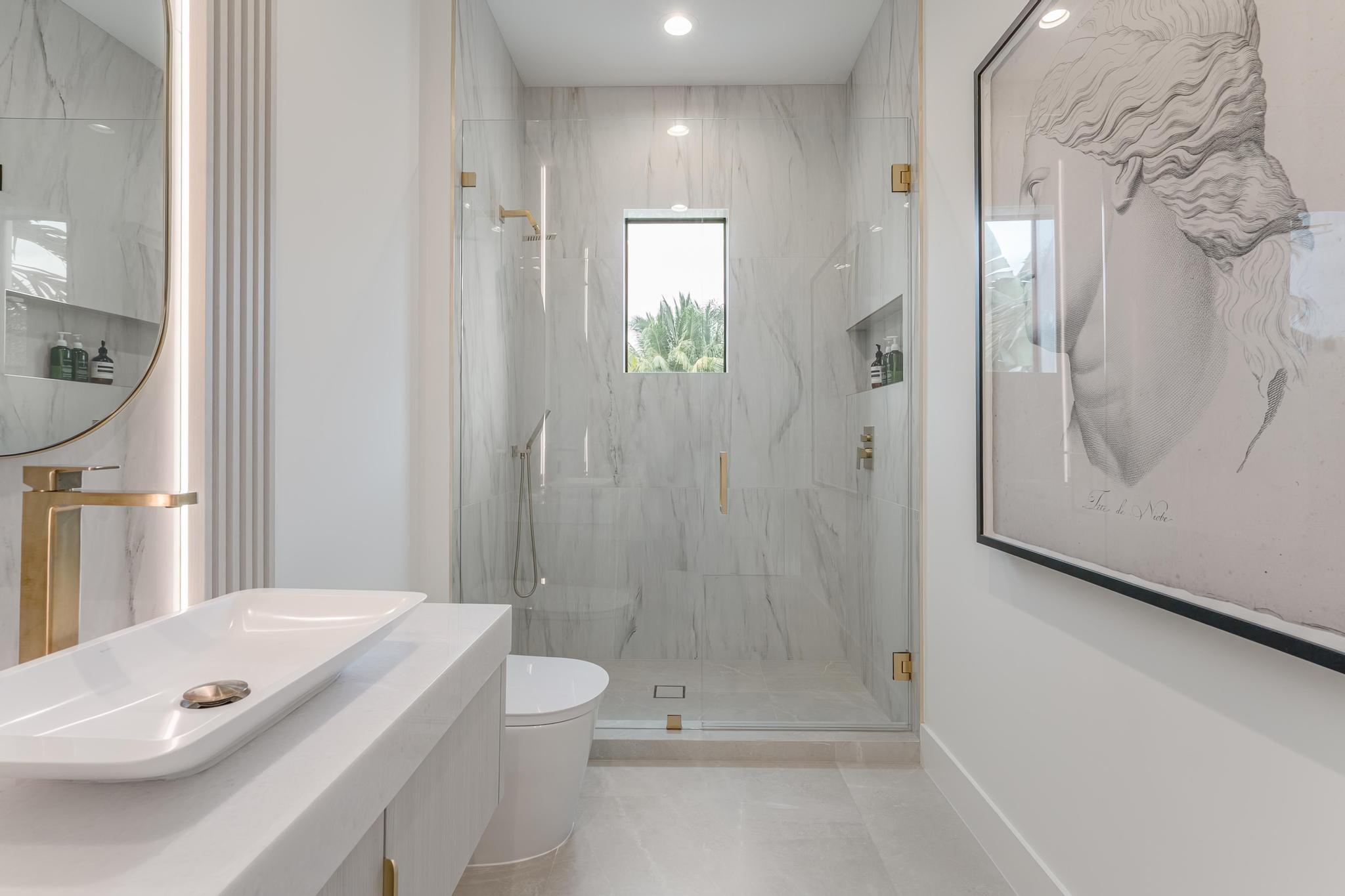 400 Northeast 4th Street Boca Raton, FL 33432 - Photo 51 of 73 a bathroom with a granite countertop sink a toilet and shower