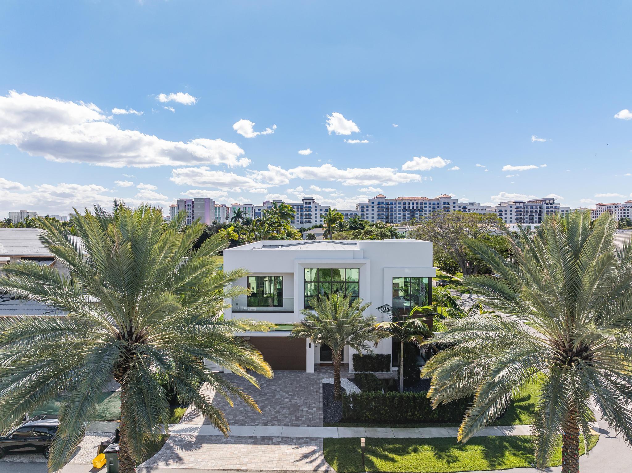 400 Northeast 4th Street Boca Raton, FL 33432 - Photo 55 of 73 a aerial view of a house with swimming pool and glass top table and chairs