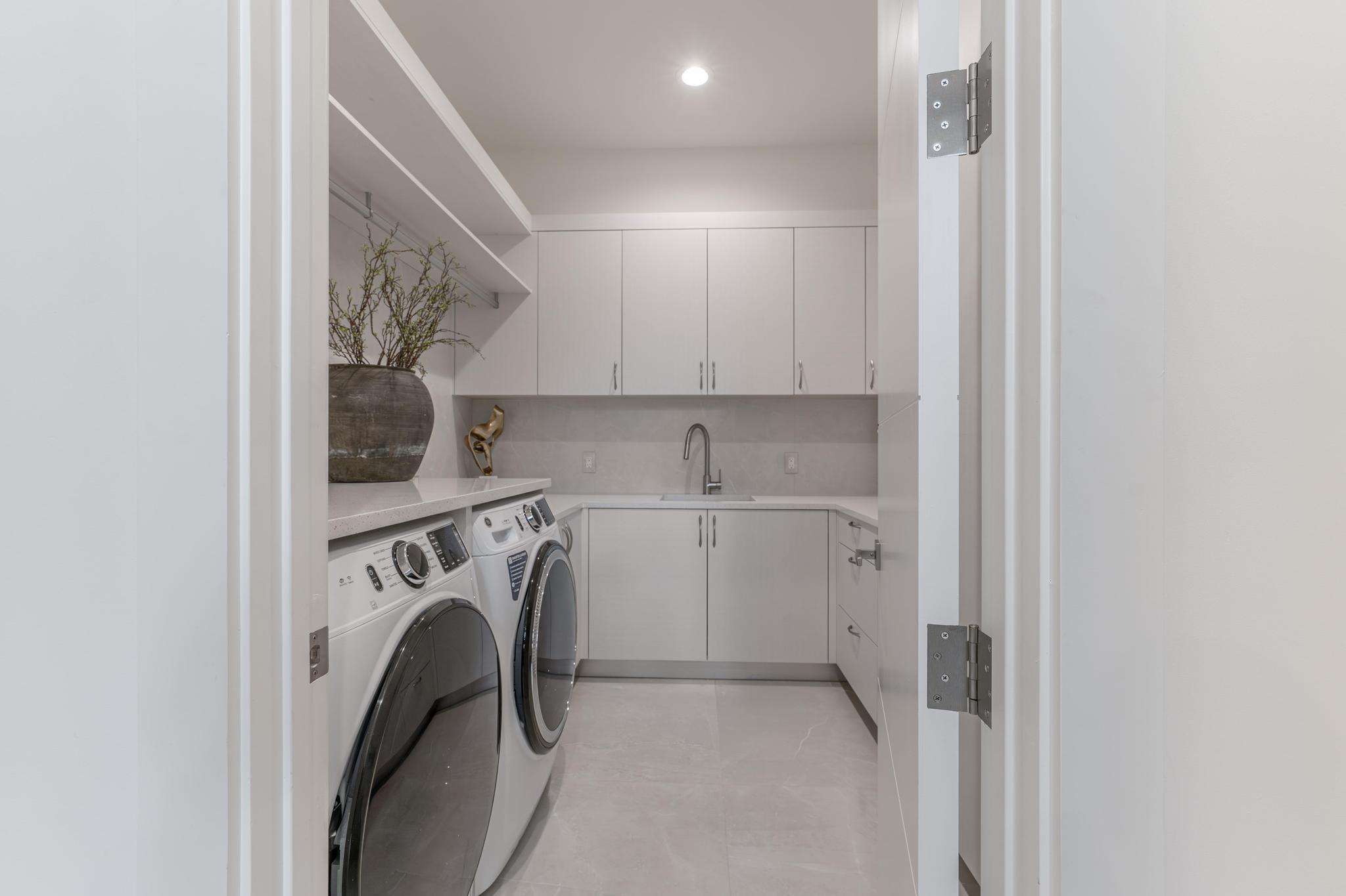 400 Northeast 4th Street Boca Raton, FL 33432 - Photo 68 of 73 a utility room with dryer and washer