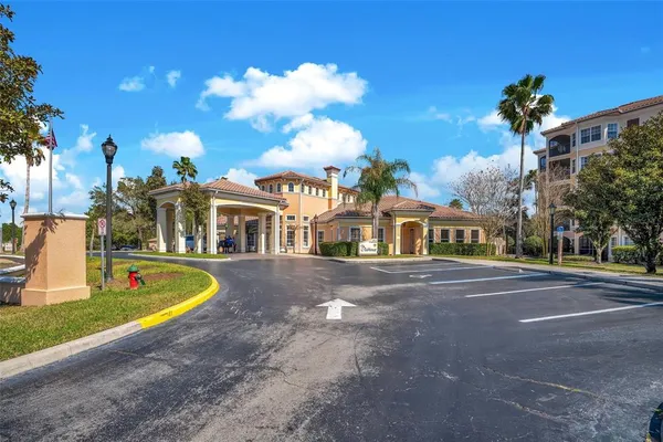 a front view of a house with swimming pool and yard