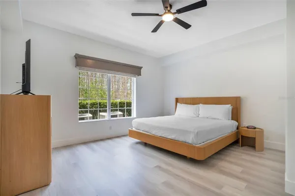 a bedroom with a bed and window