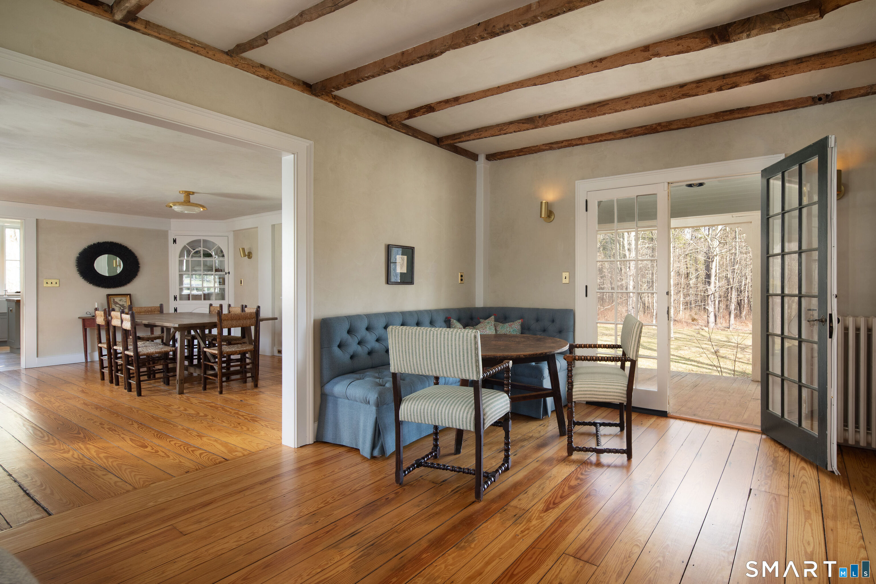 40 Music Mountain Road Canaan, CT 06031 - Photo 11 of 32 a view of a dining room with furniture and wooden floor