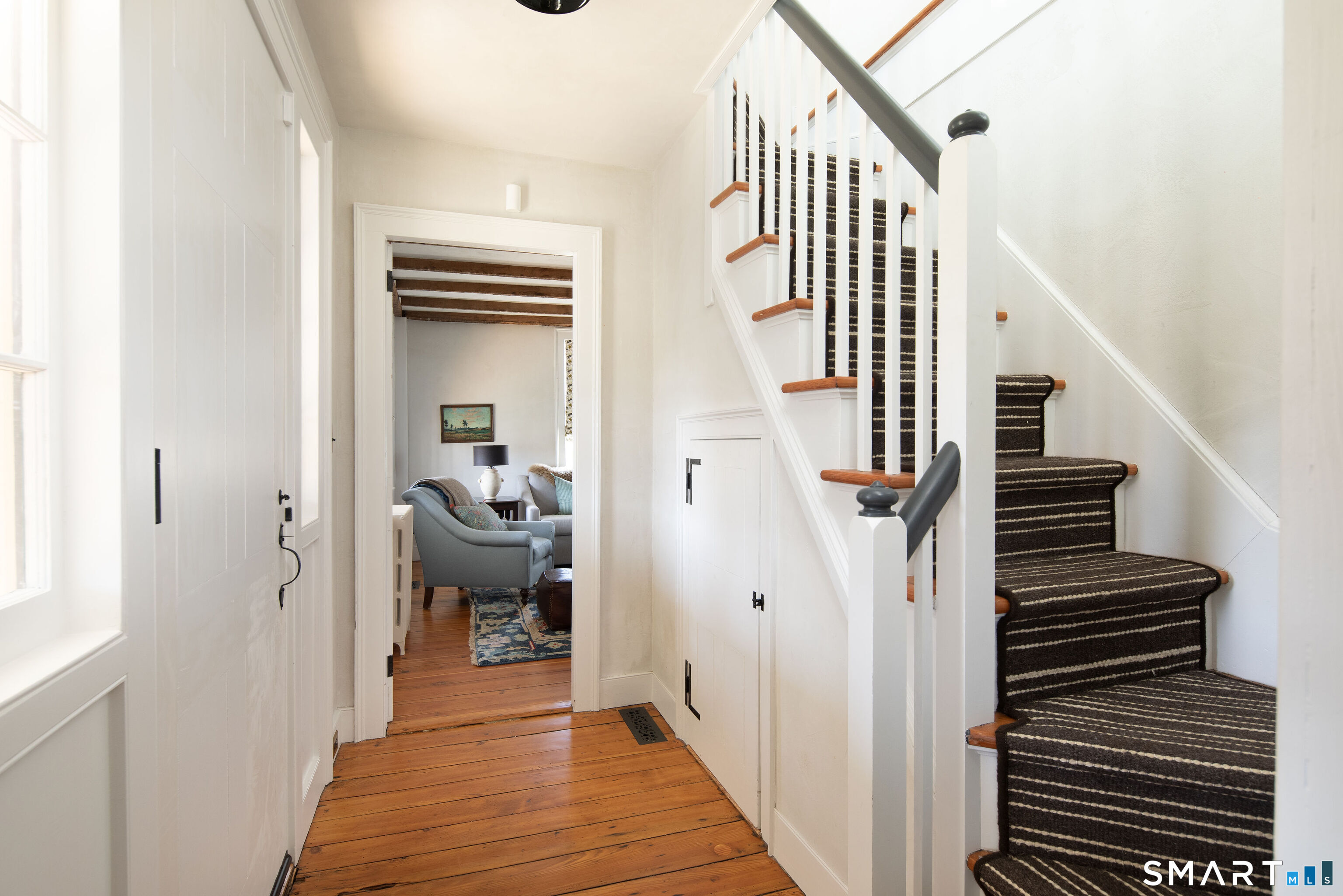 40 Music Mountain Road Canaan, CT 06031 - Photo 12 of 32 a view of a hallway with wooden floor and staircase