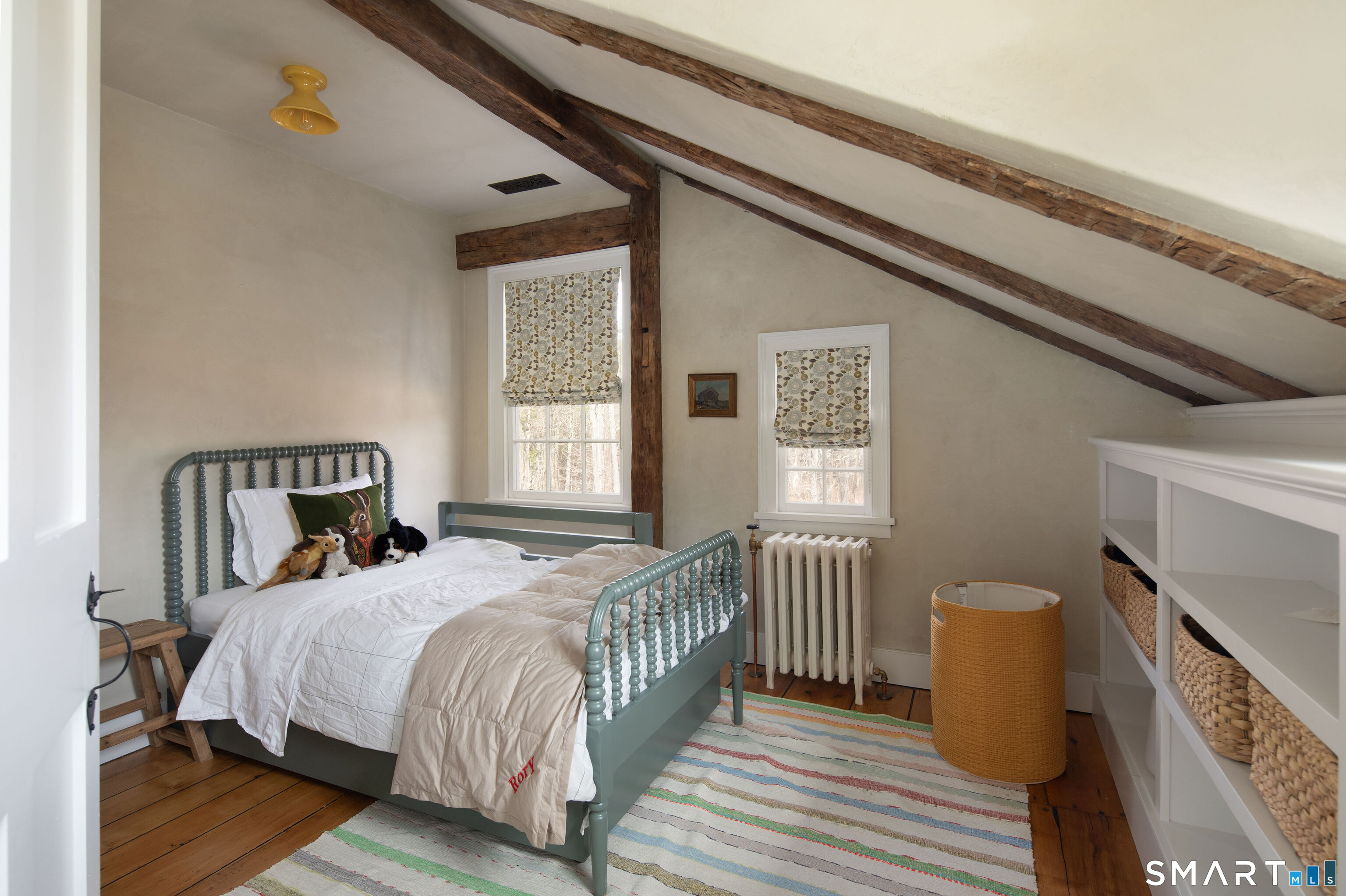 40 Music Mountain Road Canaan, CT 06031 - Photo 22 of 32 a bed sitting in a bedroom next to a window with wooden floor