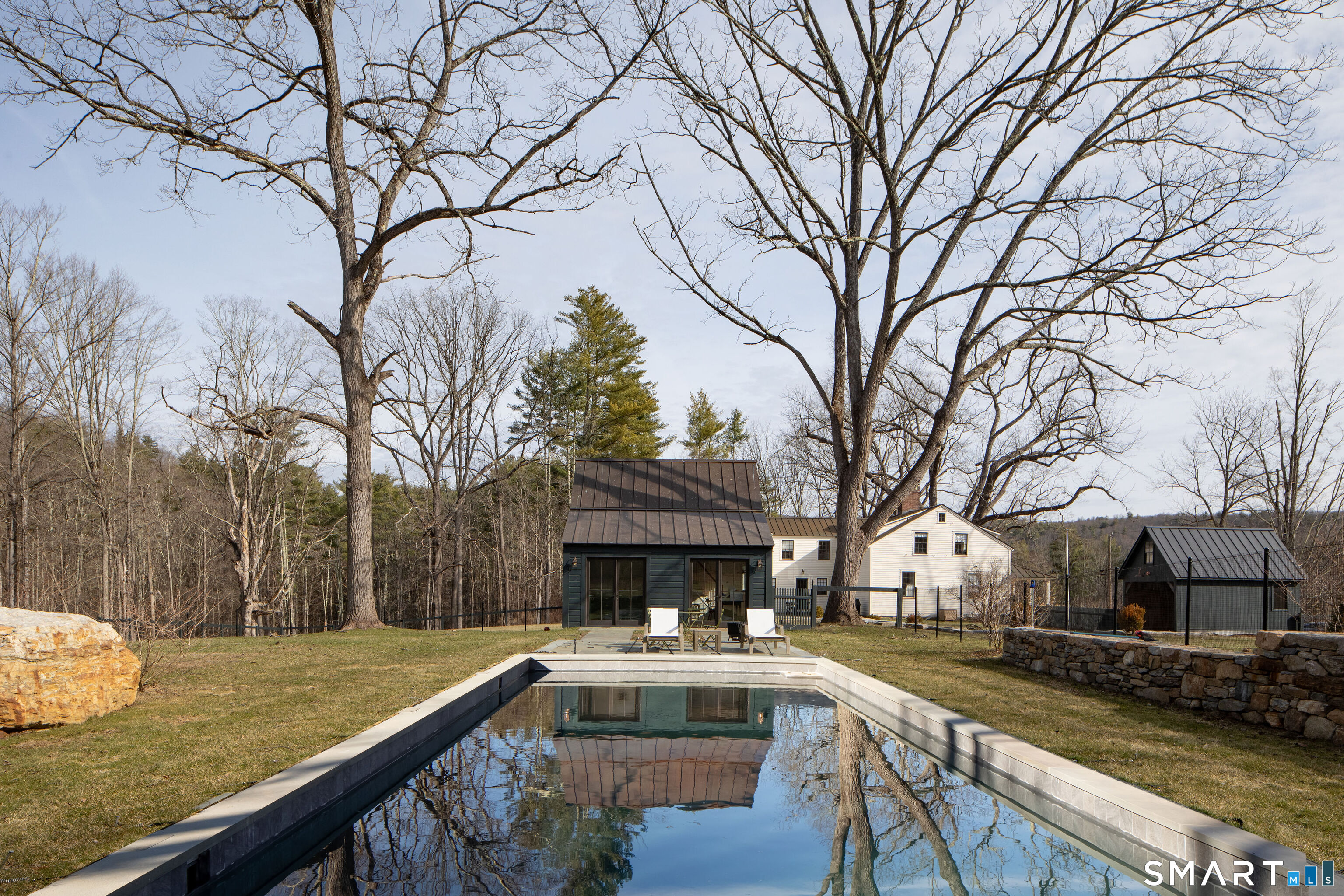 40 Music Mountain Road Canaan, CT 06031 - Photo 27 of 32 a view of house with backyard and trees