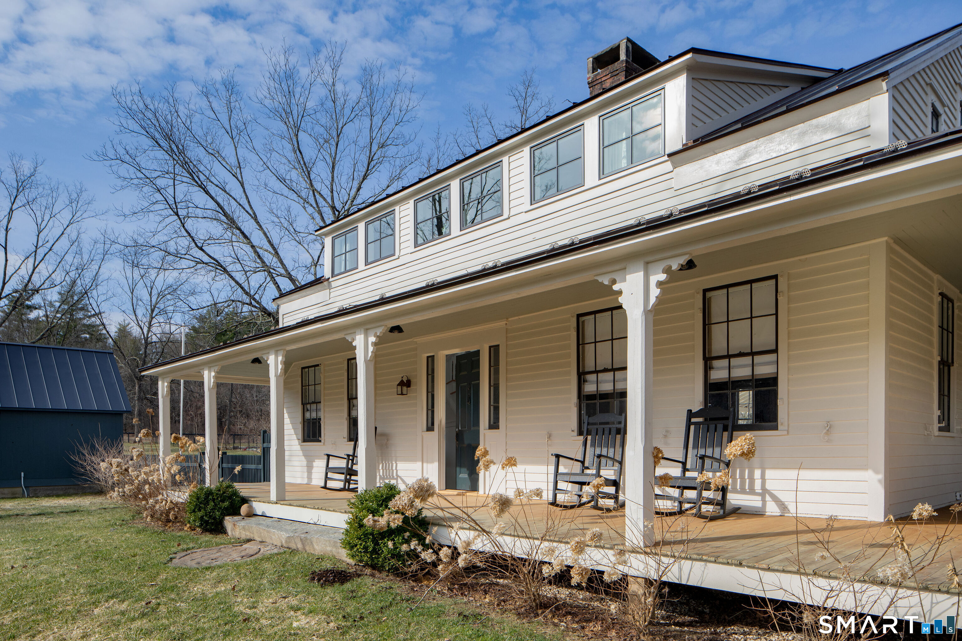 40 Music Mountain Road Canaan, CT 06031 - Photo 3 of 32 a front view of a house with garden and porch